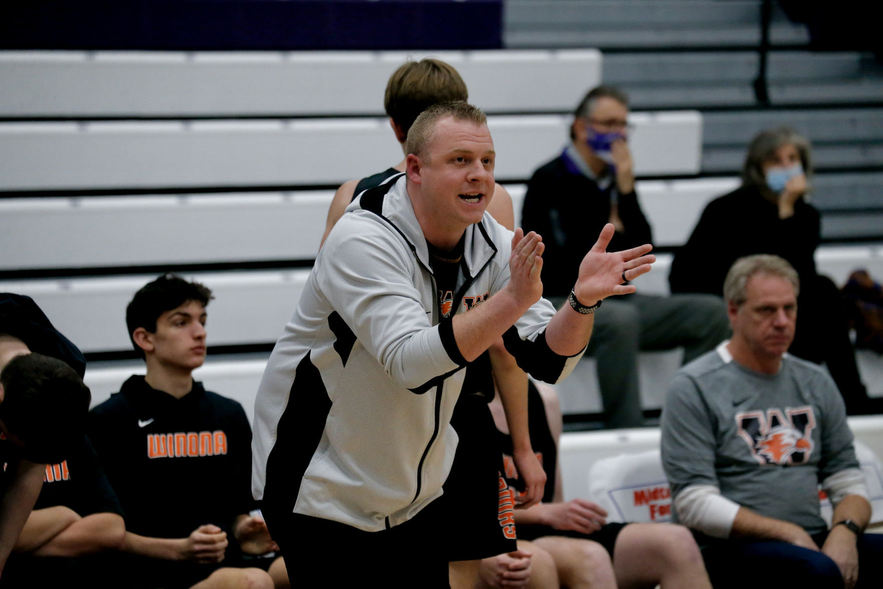 Winona coach Kyle Martin cheers on Winhawks